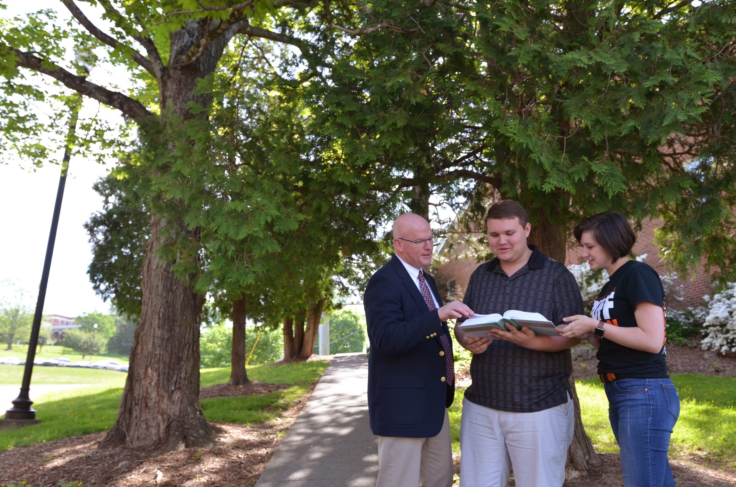 Students & Faculty Outside Sharing Faith